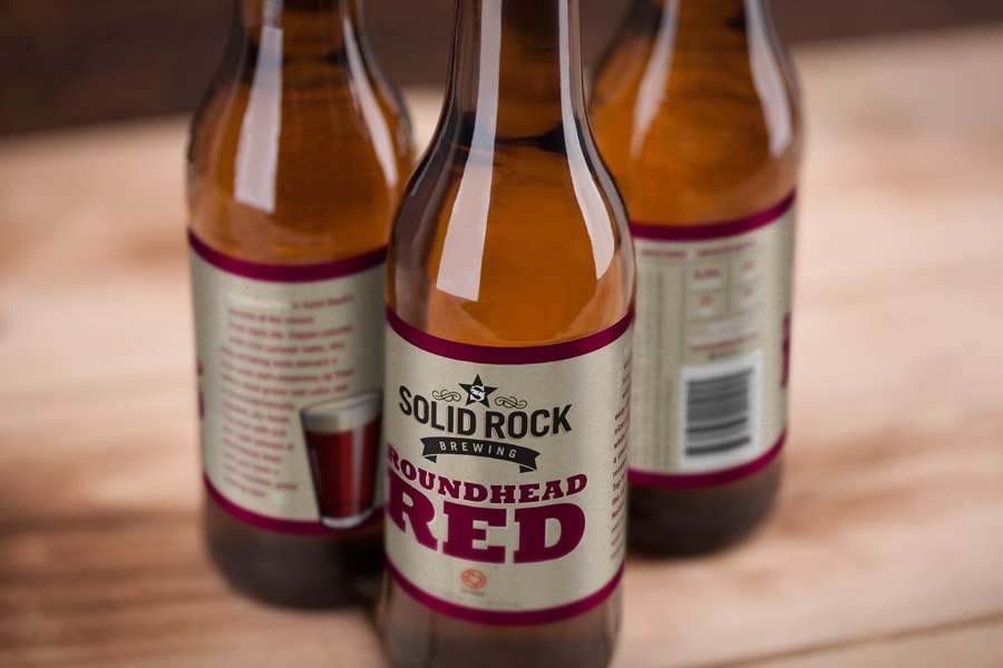 Beer labels for Solid Rock Brewing's Roundhead Red beer style